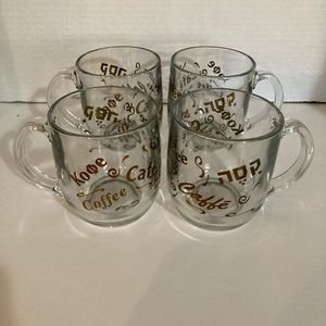 Clear glass coffee cups with imprint of Coffee in different languages.
